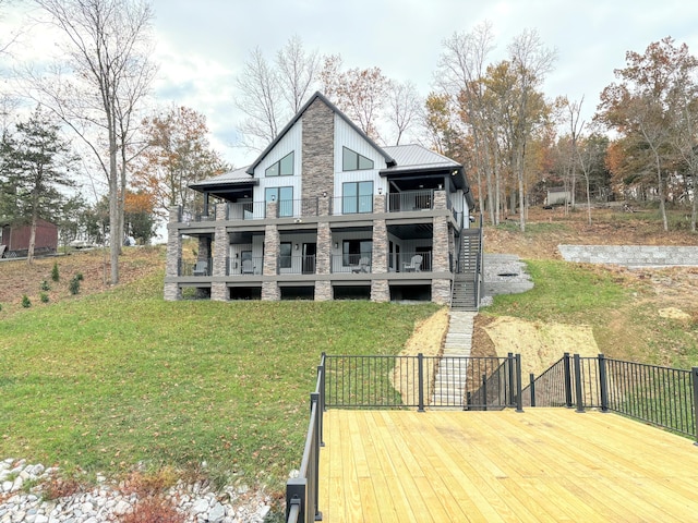 465 Cedar Hill Dr, Williamstown, KY 41097 - rear view of property with board and batten siding, stone siding, metal roof, a lawn, and a standing seam roof
