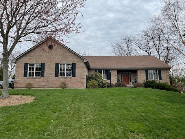 ranch-style home with a front yard