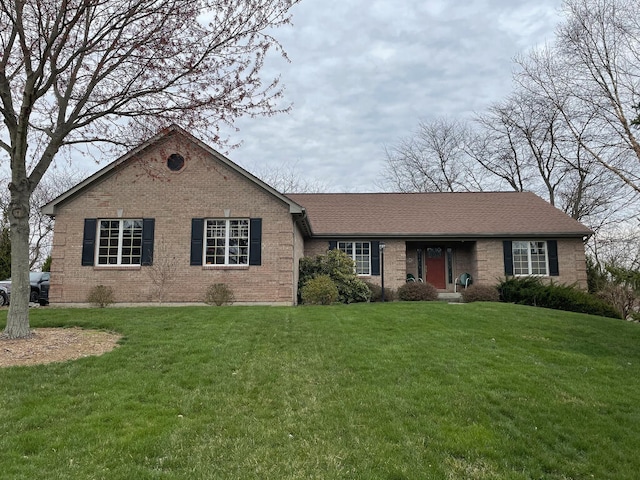 ranch-style home with a front lawn