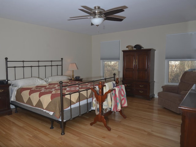 bedroom featuring ceiling fan and light wood-type flooring