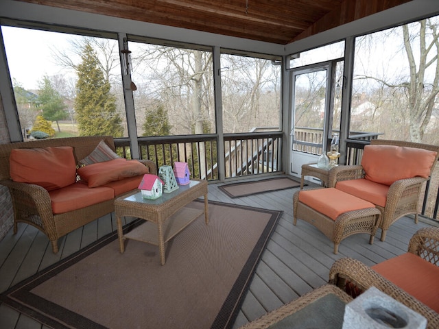 sunroom with vaulted ceiling and wooden ceiling