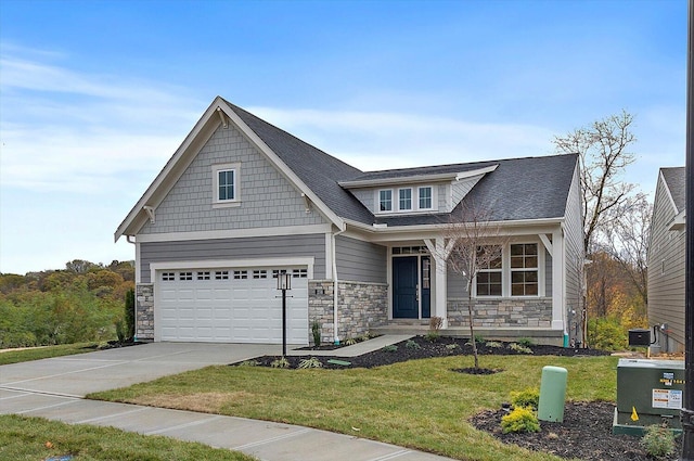 craftsman-style house featuring a porch, a garage, and a front lawn