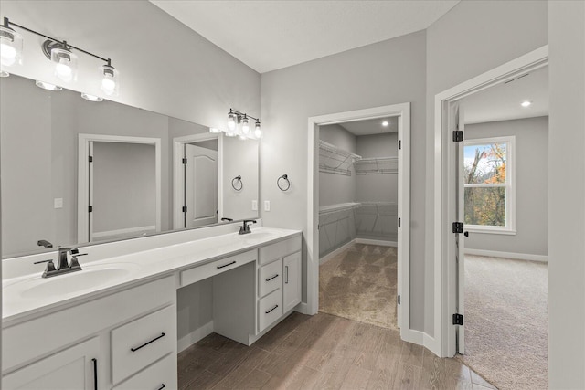 bathroom with vanity and wood-type flooring