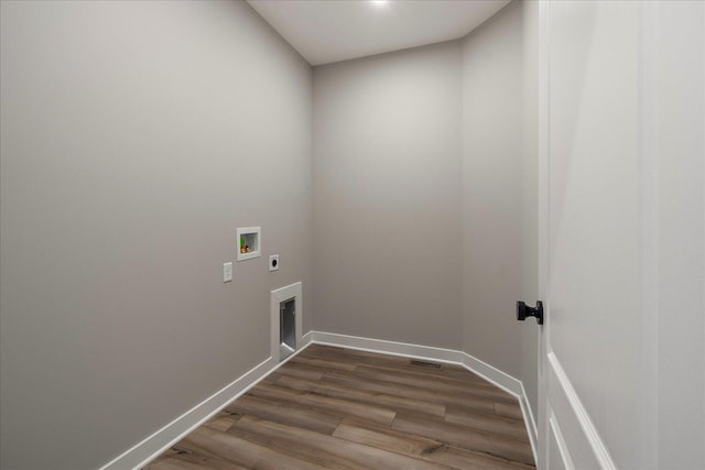 washroom featuring washer hookup, wood-type flooring, and hookup for an electric dryer