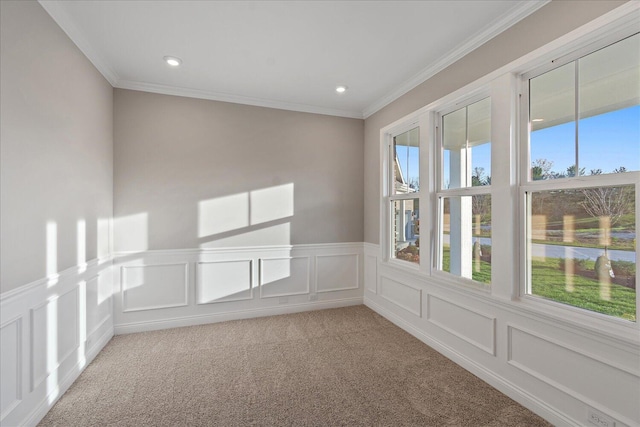 carpeted empty room with crown molding