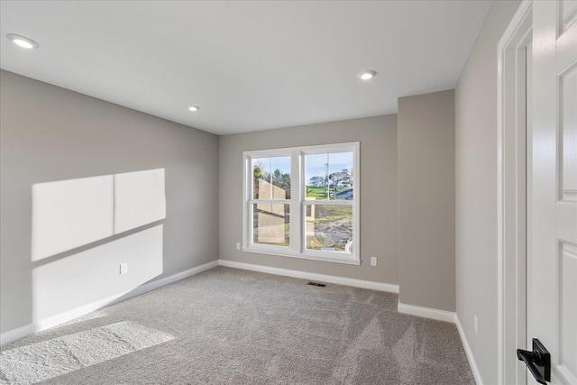 view of carpeted spare room