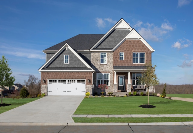 craftsman-style house with a garage and a front lawn