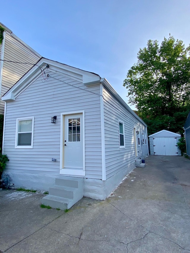 view of front of house with a storage unit