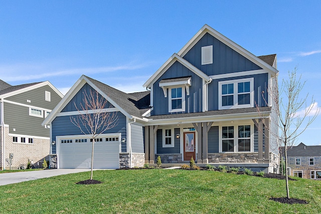 craftsman-style home with a garage, covered porch, and a front yard