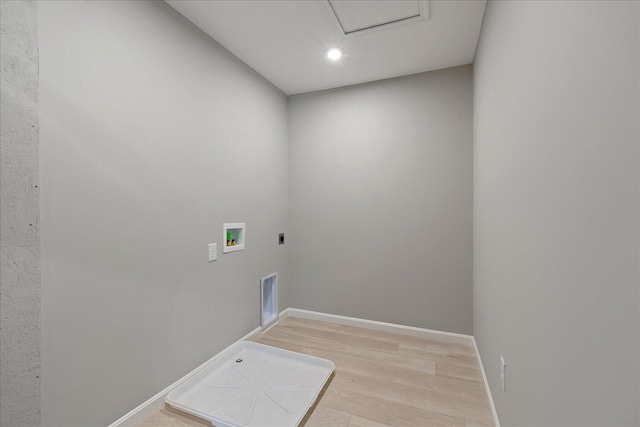 laundry area with hookup for a washing machine, light hardwood / wood-style flooring, and electric dryer hookup