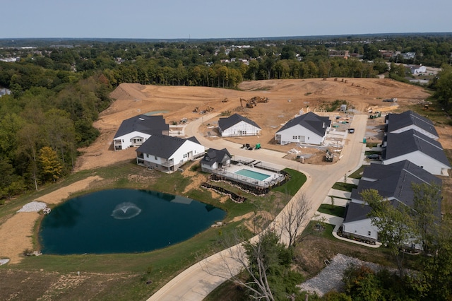 birds eye view of property with a wooded view
