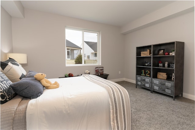 bedroom with baseboards and carpet flooring
