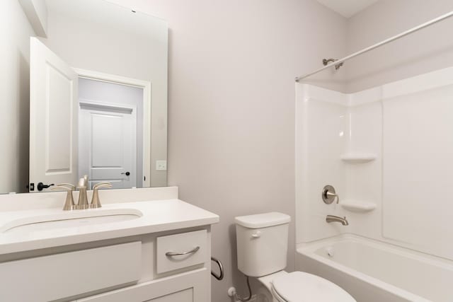 bathroom with shower / bathing tub combination, toilet, and vanity