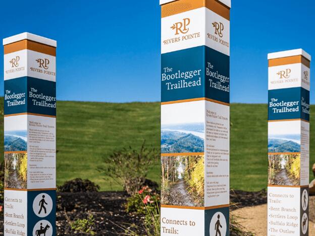 community sign featuring a mountain view