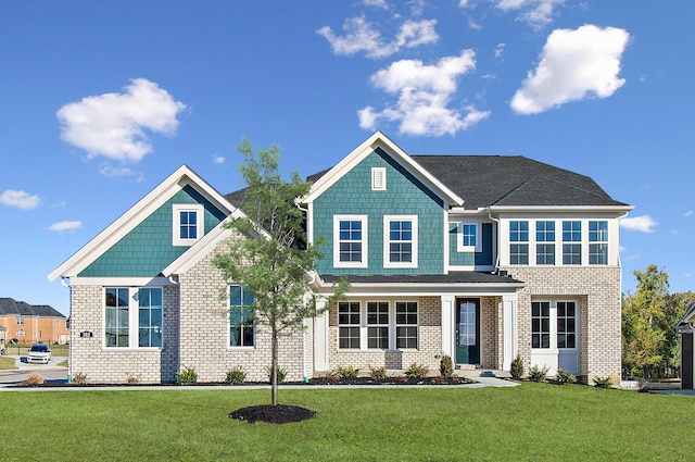 craftsman-style home featuring a front yard