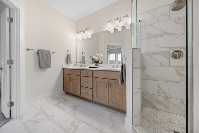 bathroom featuring vanity and tiled shower