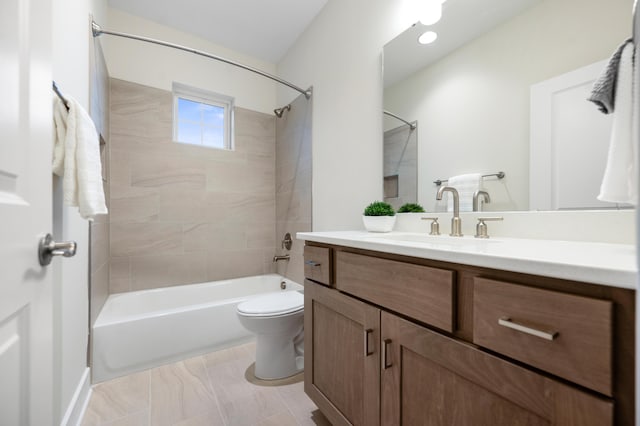 full bathroom with vanity, toilet, and tiled shower / bath