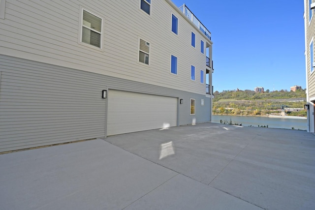 view of side of home with a garage