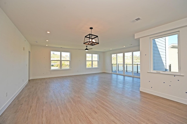 empty room featuring light hardwood / wood-style flooring and ceiling fan