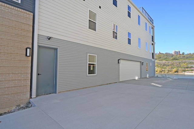 view of property exterior with a garage