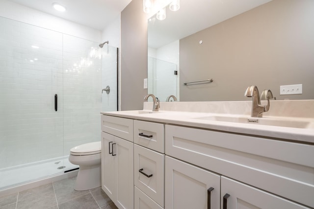 bathroom featuring walk in shower, vanity, and toilet