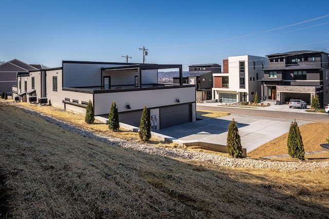 exterior space featuring a garage and central AC unit