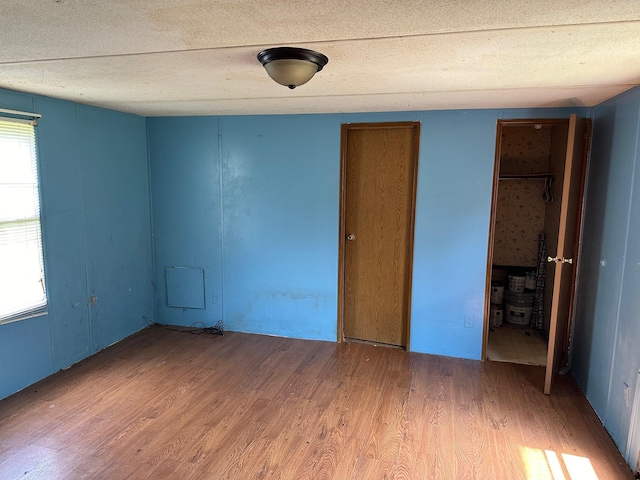 unfurnished room featuring wood-type flooring