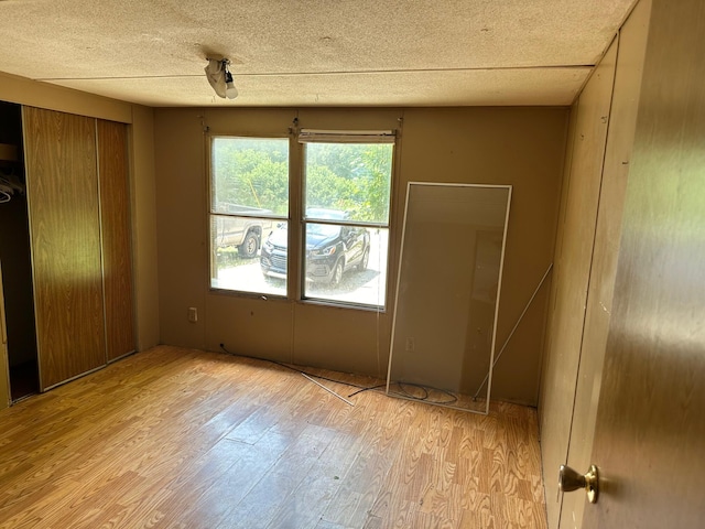 unfurnished room with light hardwood / wood-style flooring