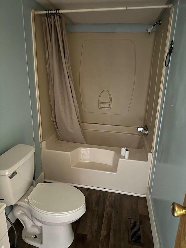 full bathroom with shower / bathtub combination with curtain, vanity, toilet, and hardwood / wood-style floors