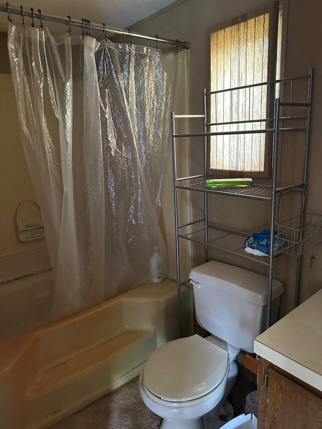 bathroom featuring toilet and shower / bath combo with shower curtain