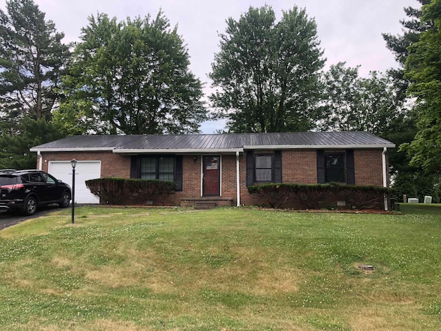 ranch-style home with a front lawn and a garage