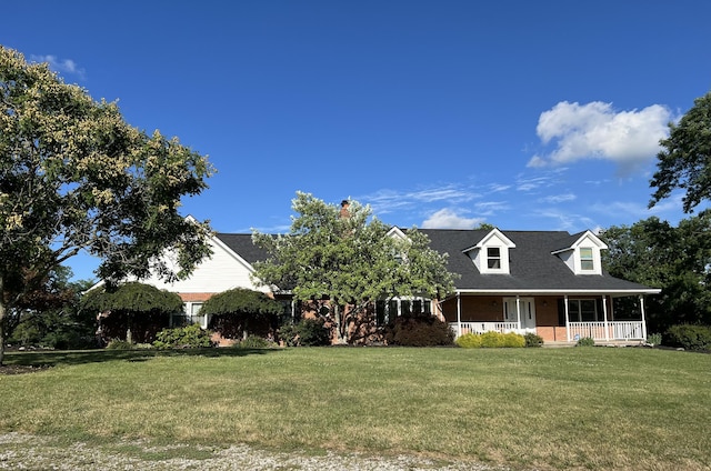 view of front of home with covered porch and a front yard