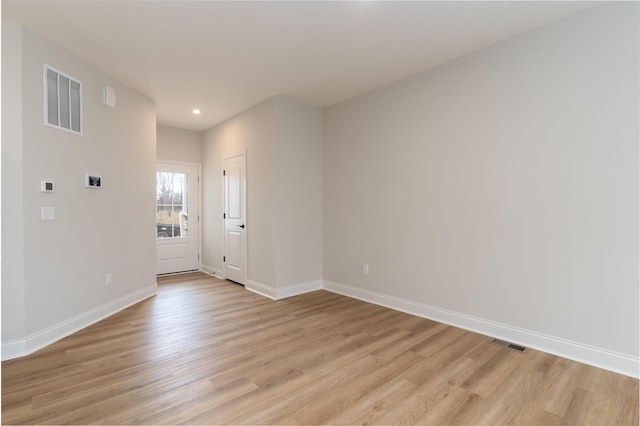 empty room with light wood-type flooring