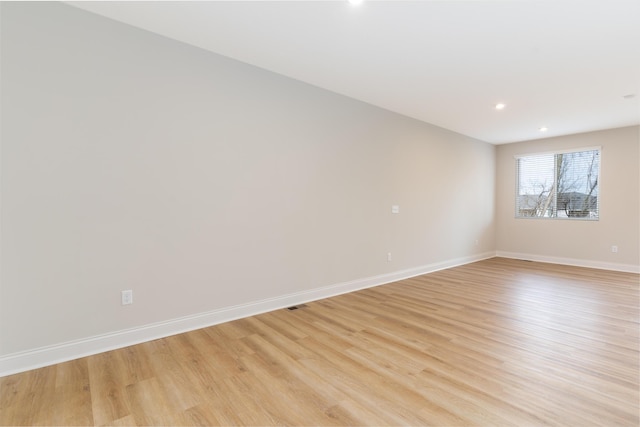 unfurnished room featuring light hardwood / wood-style flooring