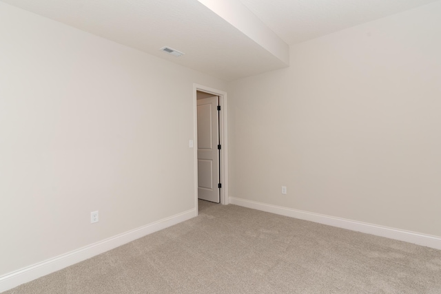 empty room with light colored carpet