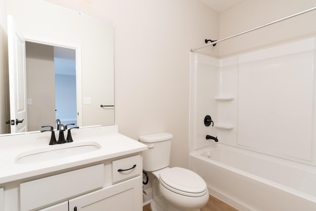 full bathroom featuring vanity, bathtub / shower combination, and toilet