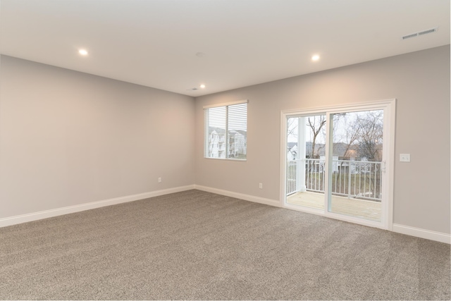 spare room featuring carpet floors