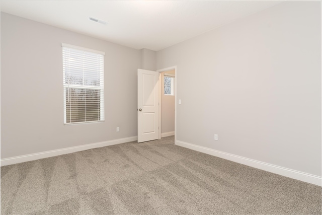 empty room with carpet flooring