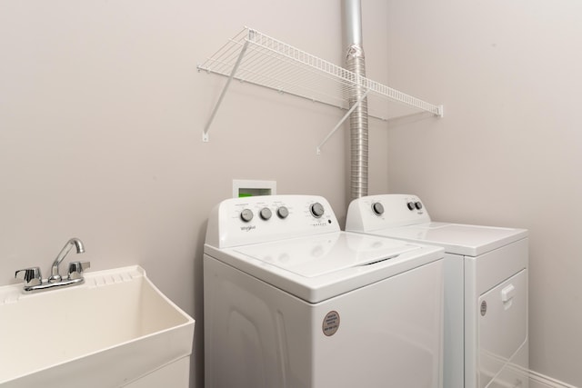 washroom featuring separate washer and dryer and sink