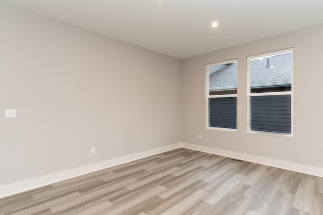 empty room with light hardwood / wood-style floors