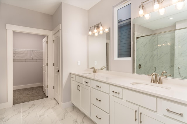 bathroom featuring vanity and a shower with shower door