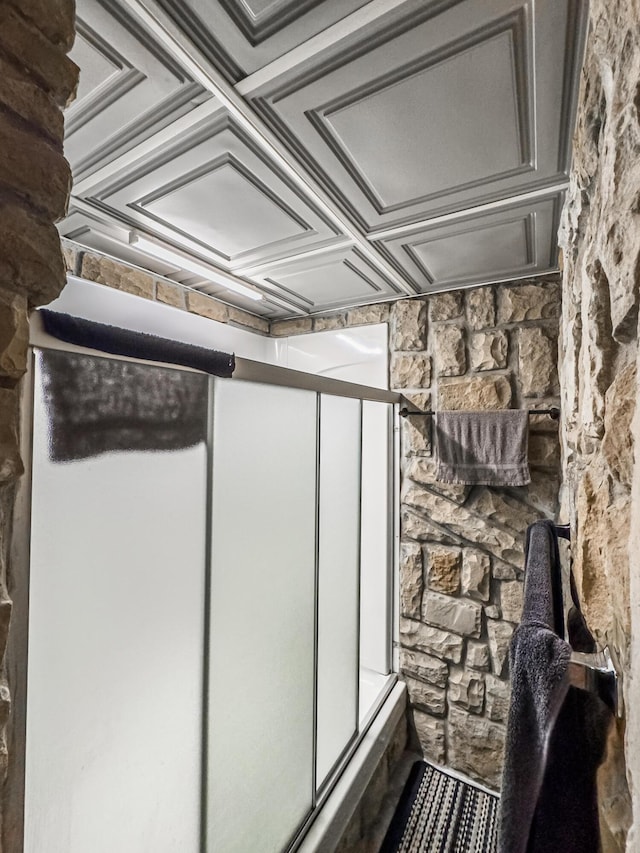 bathroom featuring coffered ceiling