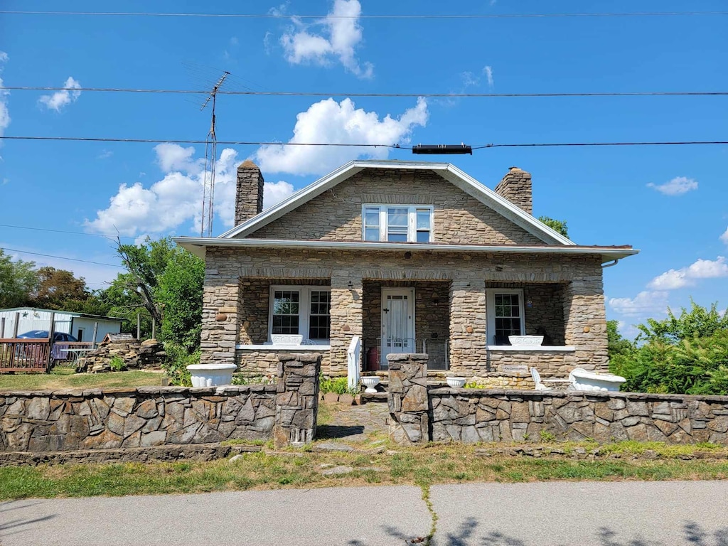 159 E Walnut St, Mount Olivet, KY 41064 - view of front of property with stone siding, covered porch, and a chimney