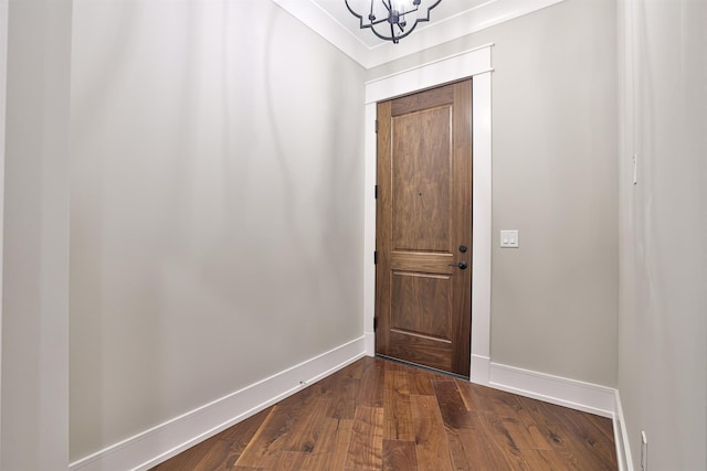 entryway featuring hardwood / wood-style floors and a notable chandelier