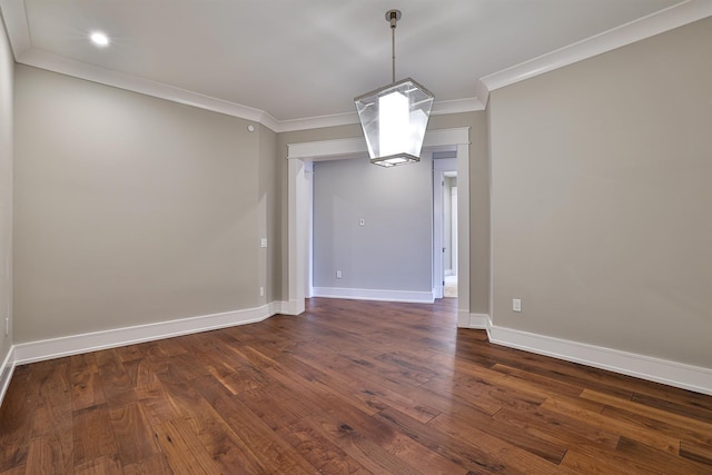 unfurnished dining area featuring dark hardwood / wood-style flooring and crown molding