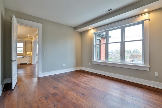 empty room with dark wood-type flooring