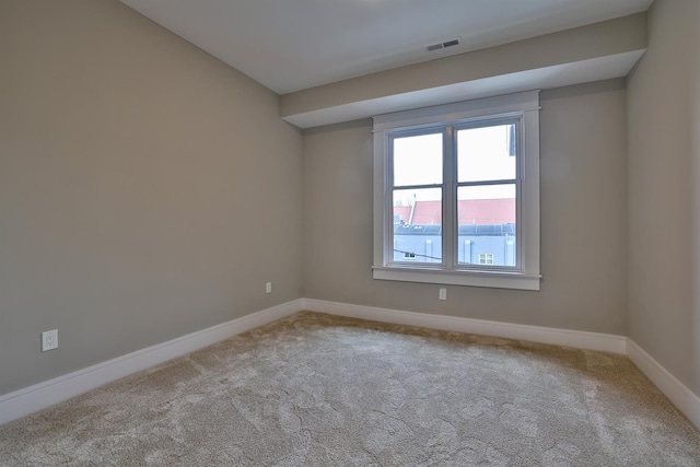 unfurnished room with carpet flooring