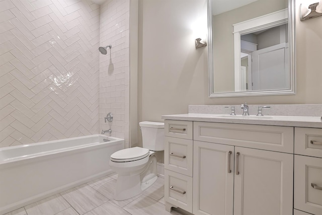 full bathroom with toilet, tiled shower / bath, and vanity