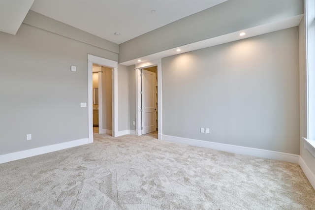 unfurnished room with light carpet