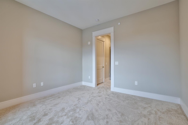 empty room with light colored carpet